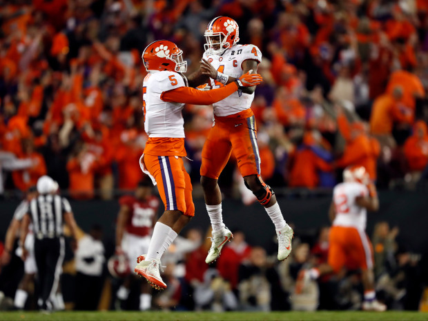 Clemson's Deshaun Watson and Shaq Smith (5) celebrate a last second touchdown during the second half of the NCAA college football playoff championship game against Alabama Tuesday, Jan. 10, 2017, in Tampa, Fla. (AP Photo/John Bazemore)